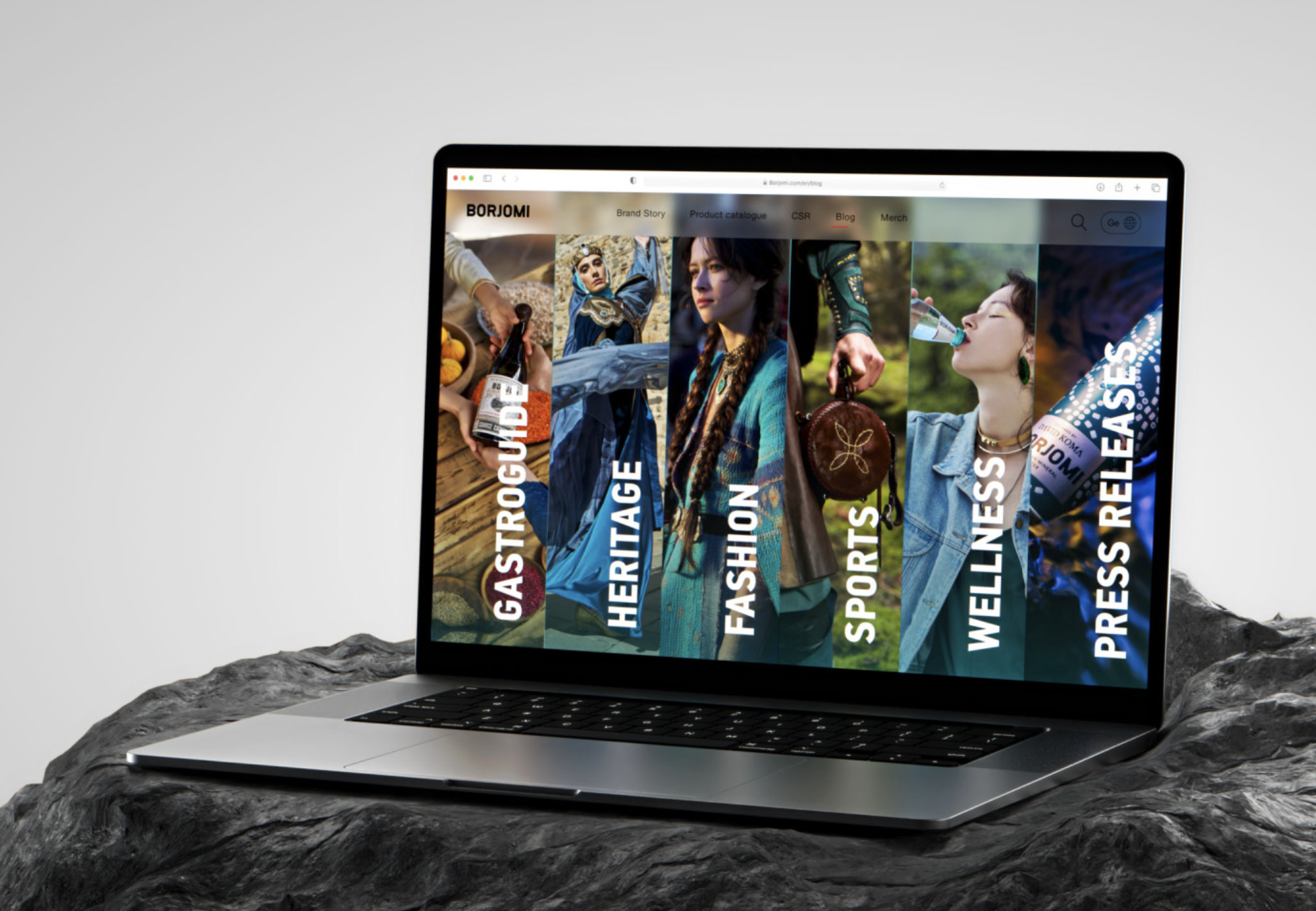 Borjomi website editorial categories presented on a laptop